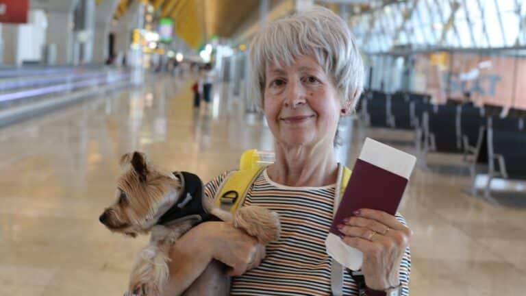 Senior woman at airport alone.