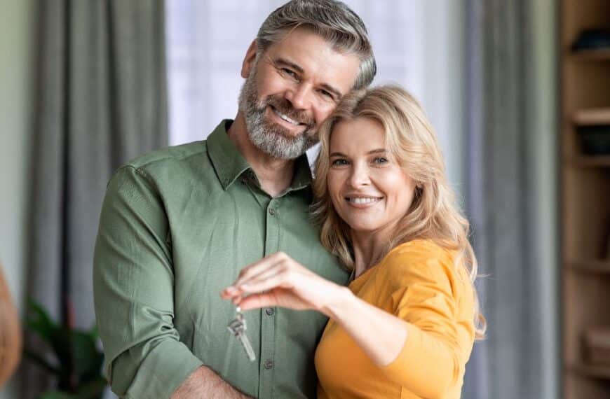Couple happily holding keys