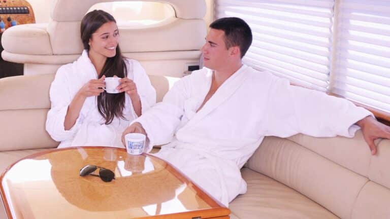 Man and woman enjoying yacht.