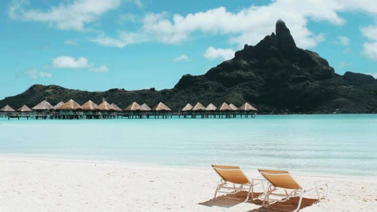 An island with cottages and beach chairs