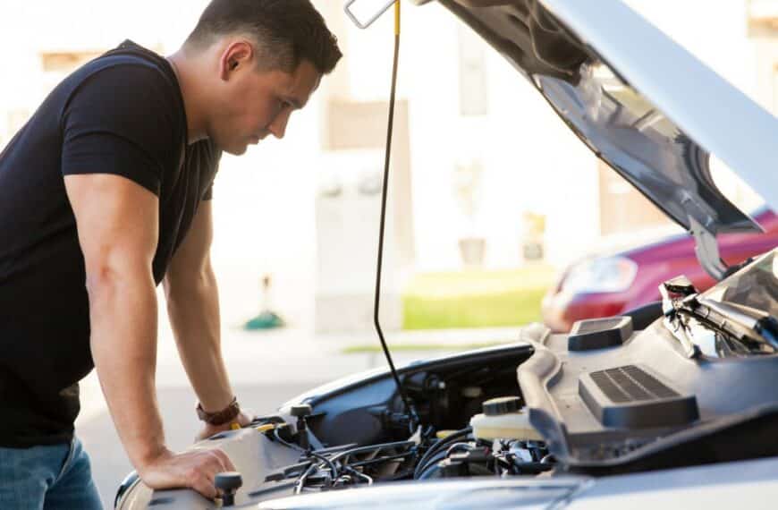 Man looking at engine car